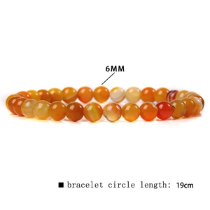 Detailed 6mm natural red agate bead bracelet with 19cm circumference on white background