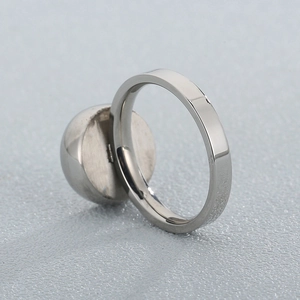 Polished stainless steel ring with spherical bead design from a 45-degree angle view