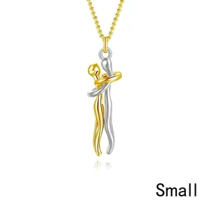 Close-up of small size hug pendant in gold and silver finish with polished chain