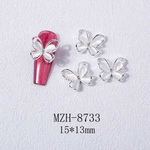 Detail showing 3D opal butterfly nail charm with silver alloy frame and center rhinestone