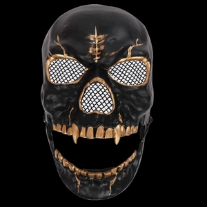 Detail of a moving jaw skeleton mask with hand-painted gold texture and black metal mesh eyes