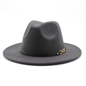 Detail of dark grey wool felt hat featuring a black leather band and golden buckle
