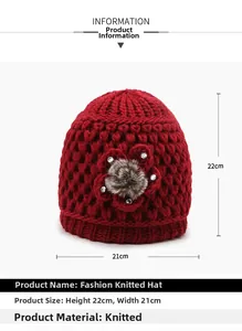 Detail view of red knit hat with sequined floral ornament and plush warm earflaps