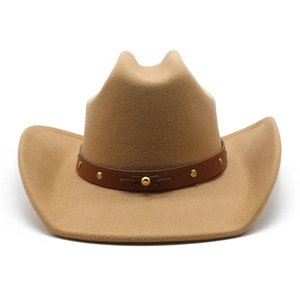 Detail of camel felt cowboy hat featuring leather band with gold studs and metal button