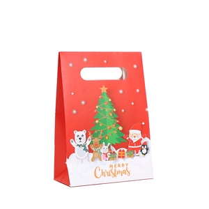 Red Christmas gift bag with Santa and reindeer cartoon prints and handle hole
