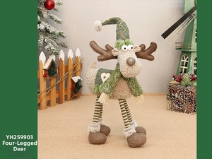 Detail of plush Christmas reindeer ornament with knitted hat and scarf decor