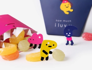 Detail of colorful gift box and shark bag with candy overflowing for snacks packaging