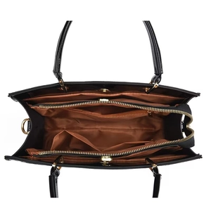 Chic black crocodile pattern handbag with spacious brown interior and gold hardware