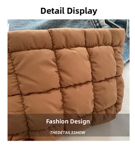 Macro shot of quilted brown nylon fabric with square stitching and padded texture