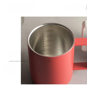Close-up of matte red stainless steel mug with precise internal 300ml scale markings