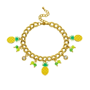 Detail of gold chain bracelet featuring enamel pineapple charm and green beaded accents