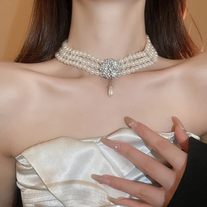 Elegant multi-layer pearl choker with sparkling flower diamond and teardrop pendant
