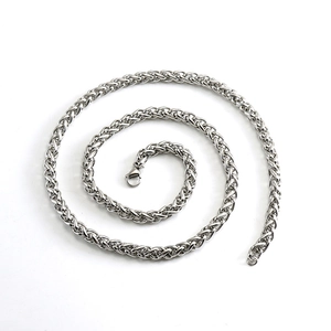 Silver stainless steel keel chain necklace with woven spiral design on white background