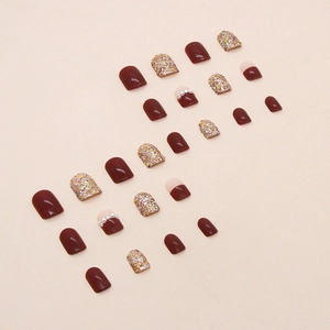 Sparkly burgundy press-on nails set with glitter, pearls, and square shapes for festive looks