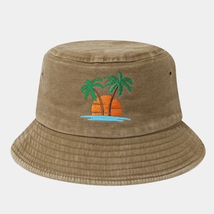 Detailed embroidery of palm trees and sunset on khaki washed cotton bucket hat