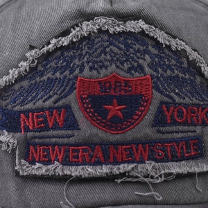 Washed distressed baseball cap with New York 1985 embroidery and vintage star design