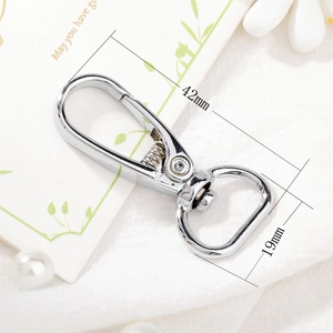 Macro view of silver alloy lobster clasp showing detailed 42mm by 19mm dimensions