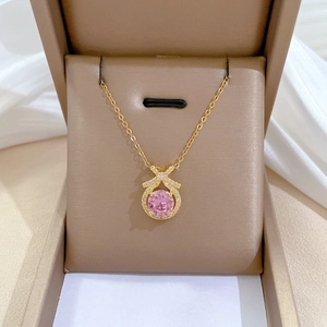 Titanium steel necklace with a bow pendant and pink crystal in a luxury jewelry box