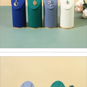 Detail of solid wood jewelry display stands with velvet finish and golden metal bases