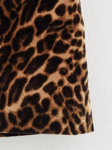 Close-up of leopard print fabric texture for a high-quality women's fashion suit