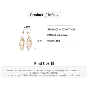 Detail view of gold hollow oval clip-on earrings with layered spiral and geometry dimensions
