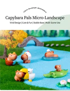Detailed view of Capybara figurines in a miniature landscape with moss and blue sand