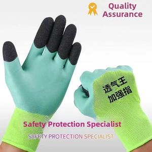 Close-up of green knit work gloves with black crinkle latex coating for extra grip