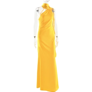 Detailed view of yellow satin evening dress showing the halter neck and pleated texture