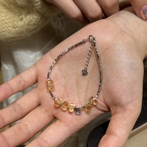 S925 sterling silver beaded bracelet with orange citrine cubes and heart charm on wrist