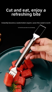 Close-up of stainless steel 2-in-1 watermelon slicer and fork tool cutting fresh fruit