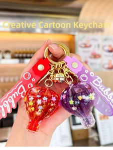 Detailed close-up of hot air balloon keychains with sequins, flowers, and Bubble wrist strap