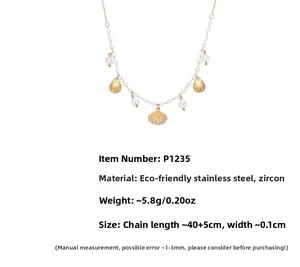 Close-up of stainless steel shell necklace with cubic zirconia and pearl charms