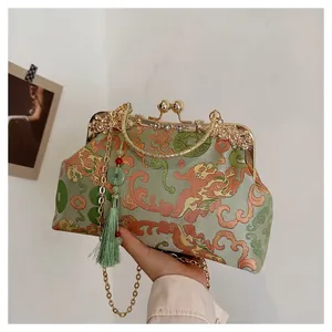 Vintage green satin evening bag with Chinese lion embroidery and golden metal frame