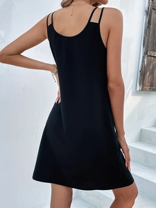 Detailed back view of sleeveless black V-neck dress showing slim fit and double straps