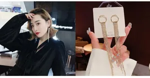Detail of S925 silver long tassel earrings with sparkling rhinestones on an elegant model