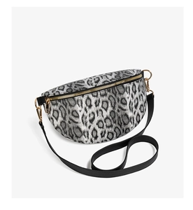 Detail of leopard print crossbody waist bag featuring gold zippers and adjustable strap