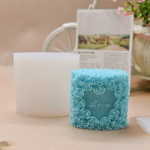 Blue rose heart Love candle with its silicone DIY craft mold on a decorative background