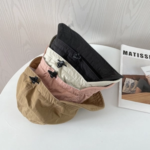 Foldable nylon bucket hats in four colors with adjustable drawstrings and texture