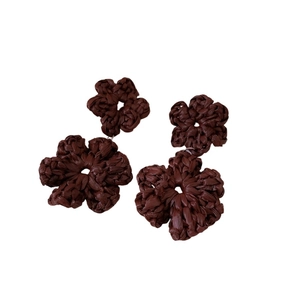Handmade woven flower earrings in dark brown raffia with a bohemian resort style