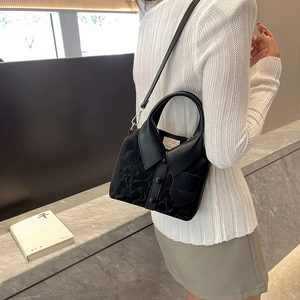 Stylish black woolen handbag with PU leather details and a fashion-themed text pocket