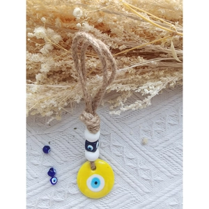 Handmade Evil Eye wall hanging with yellow glass disk and rustic twine rope decoration