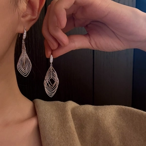 Silver oval hollow geometric drop earrings with sparkling zircon for a minimalist look