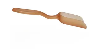 Detail view of a brown translucent plastic tea scoop with a sleek streamlined handle