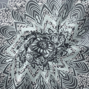 Détail du tissu de tapisserie mandala bohème montrant la texture tissée et les plis