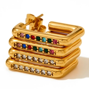 Detail of square gold-plated earrings set with colorful and clear cubic zirconia stones