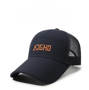 Detail view of breathable mesh back and orange embroidered logo on navy baseball cap