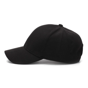 Close-up of black cotton twill baseball cap with six-panel design and curved brim