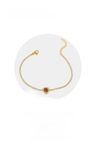 Close-up detail of heart-shaped red zircon pendant with silver tennis chain necklace