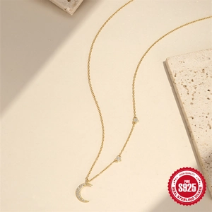 Elegant gold S925 sterling silver necklace featuring moon and star pendant with diamonds