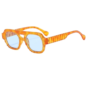 Vintage pilot sunglasses with amber textured frames and transparent light blue lenses